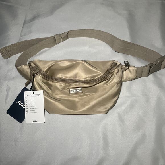 NEW The Foldie Anti-Theft Crossbody Bag Beige Tan RFID Fanny Pack Foldable NWT - Picture 1 of 7